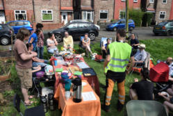 group of people gathered in community garden