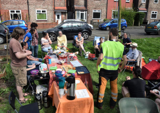 group of people gathered in community garden