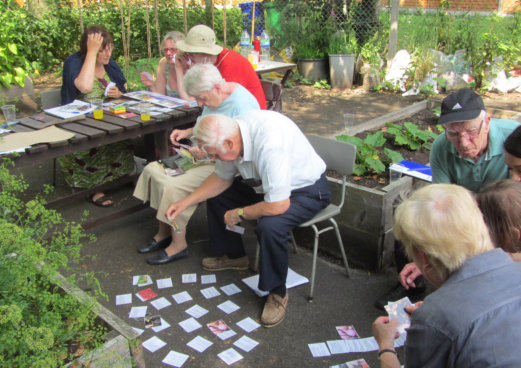 older adults take part in training workshop in community garden